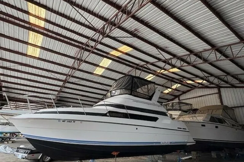 Slide: The Image of 1991 Carver 3067 Santego yacht stored in a covered marina. - 5