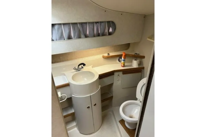 Slide: The Image of Bathroom interior of 1991 Carver 3067 Santego yacht, featuring sink and toilet. - 22