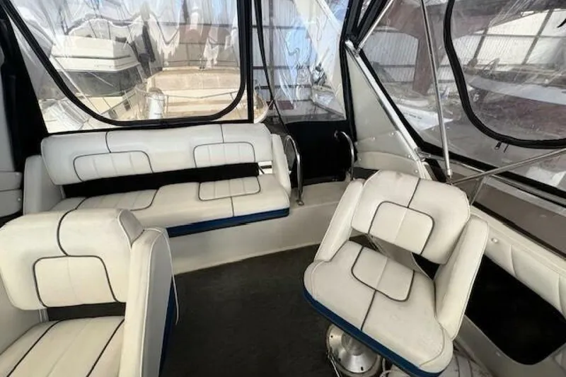 Slide: The Image of Interior of a 1991 Carver 3067 Santego boat with white seating. - 10