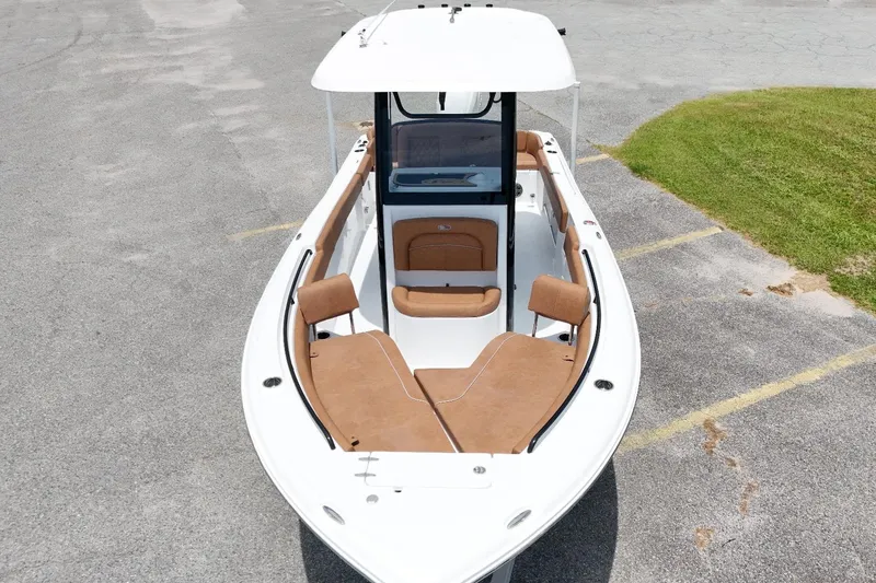 Slide: The Image of 2027 Sea Hunt Ultra 235 SE boat with tan seating, aerial view. - 9