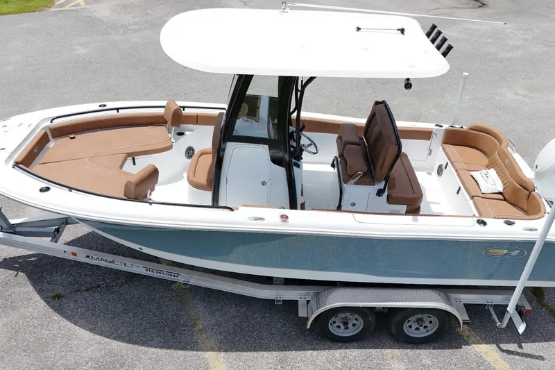 Slide: The Image of 2027 Sea Hunt Ultra 235 SE boat on trailer, featuring spacious seating and sleek design. - 4