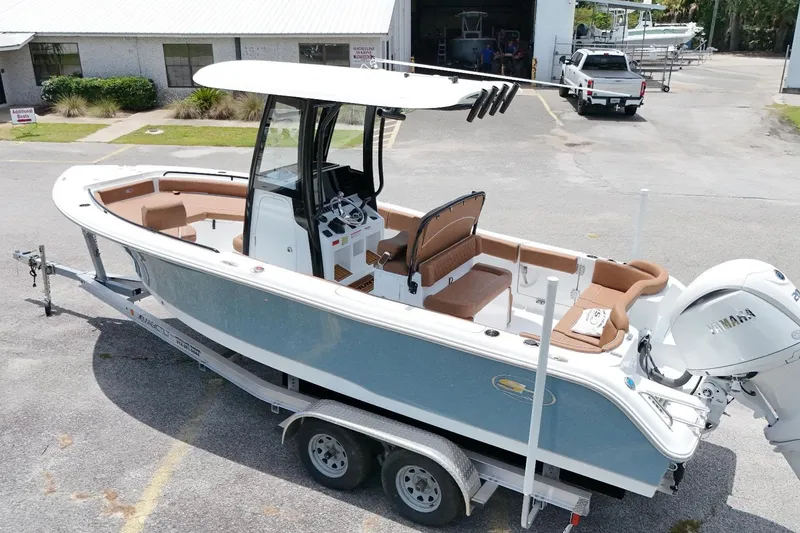 Slide: The Image of 2027 Sea Hunt Ultra 235 SE boat on trailer, featuring sleek design and Yamaha engine. - 7