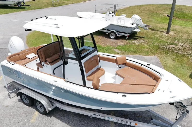 Slide: The Image of 2027 Sea Hunt Ultra 235 SE boat on trailer, featuring spacious seating and sleek design. - 3