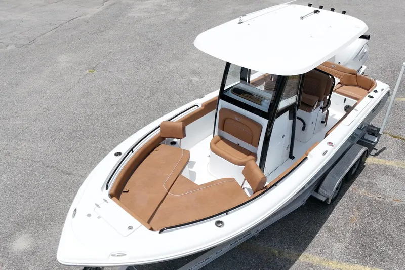 Slide: The Image of 2027 Sea Hunt Ultra 235 SE boat with sleek design and spacious seating. - 6