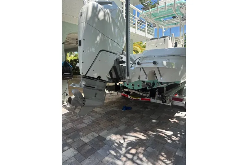Slide: The Image of 2023 Caymas 281 HB boat with powerful outboard motor on a trailer. - 7