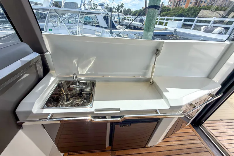 Slide: The Image of Outdoor kitchenette on 2019 Galeon 485 HTS yacht with sink and counter space. - 7