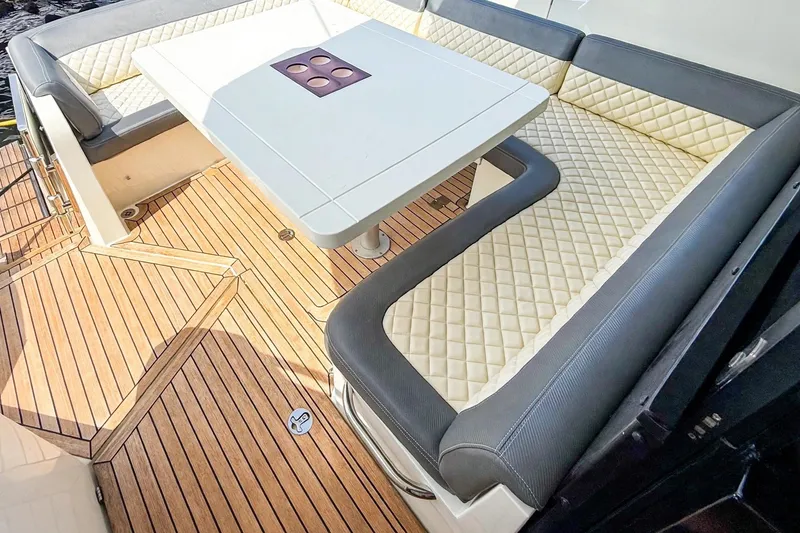 Slide: The Image of Luxurious seating area on 2019 Galeon 485 HTS yacht with quilted cushions and wooden flooring. - 5