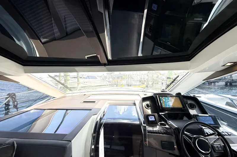 Slide: The Image of Interior view of 2019 Galeon 485 HTS yacht cockpit with modern navigation equipment. - 11