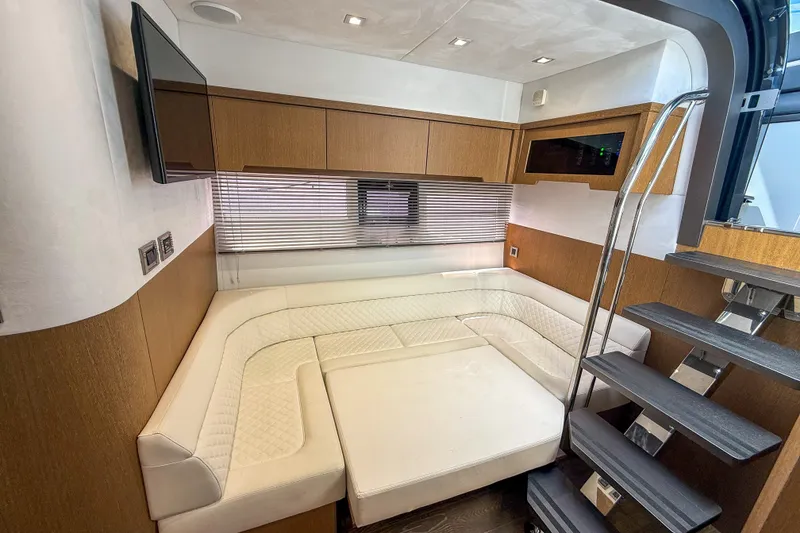 Slide: The Image of Luxurious interior of 2019 Galeon 485 HTS yacht with modern seating and wooden accents. - 16