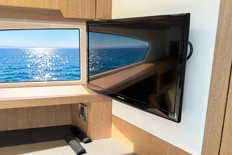 Slide: The Image of Interior of 2019 Galeon 485 HTS yacht with TV and ocean view window. - 27