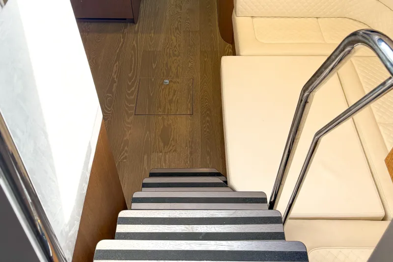 Slide: The Image of Staircase and seating area inside 2019 Galeon 485 HTS yacht. - 14