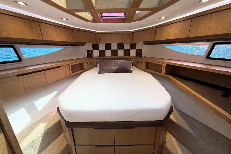 Slide: The Image of Luxurious interior of 2019 Galeon 485 HTS yacht with elegant wood finish and spacious bed. - 21