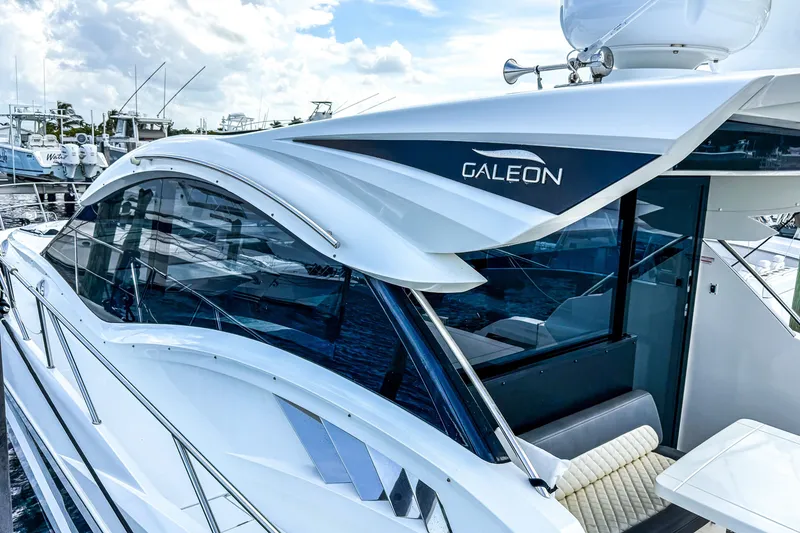 Slide: The Image of 2019 Galeon 485 HTS yacht docked, showcasing sleek design and modern features. - 4