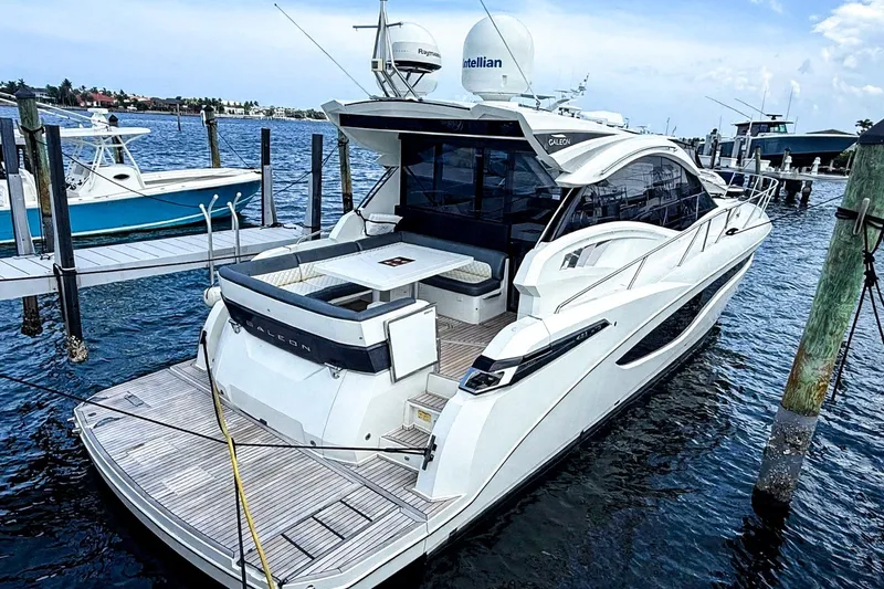 The Image of 2019 Galeon 485 HTS yacht docked at marina, showcasing sleek design and modern features. - 0