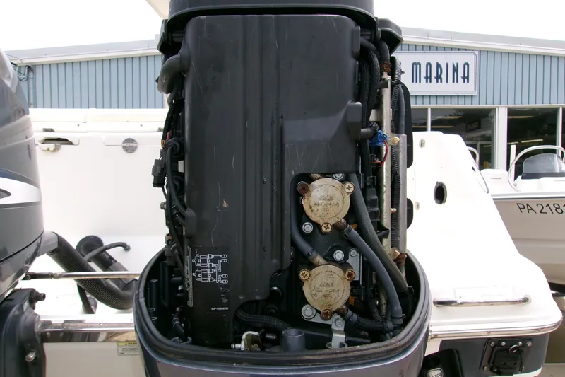 Slide: The Image of 2010 Robalo R240 Center Console boat engine at marina, detailed view. - 27