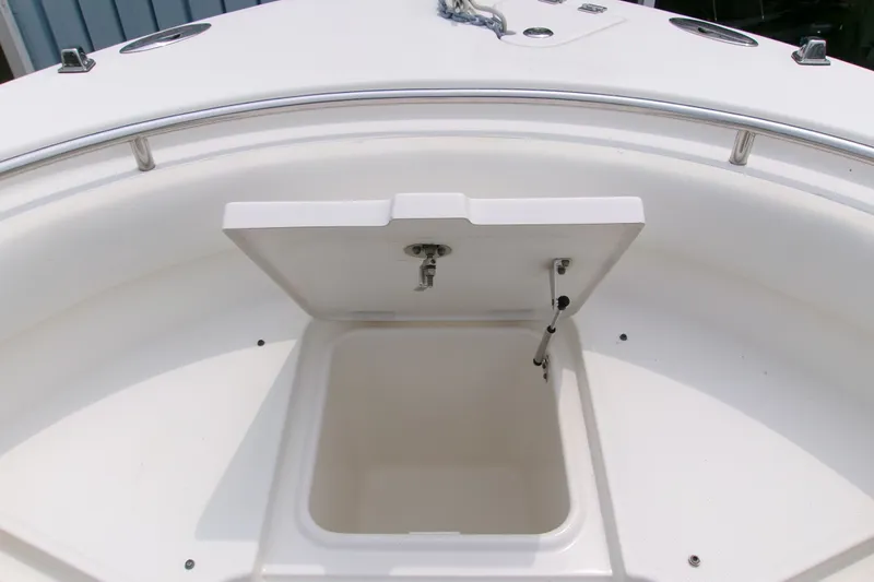 Slide: The Image of Open storage compartment on 2010 Robalo R240 Center Console boat deck. - 44