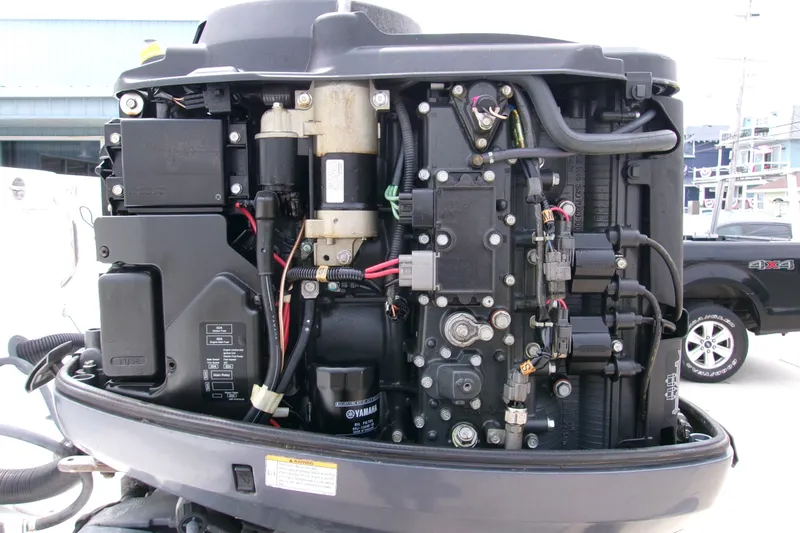 Slide: The Image of Close-up of a Yamaha outboard motor on a 2010 Robalo R240 Center Console boat. - 30