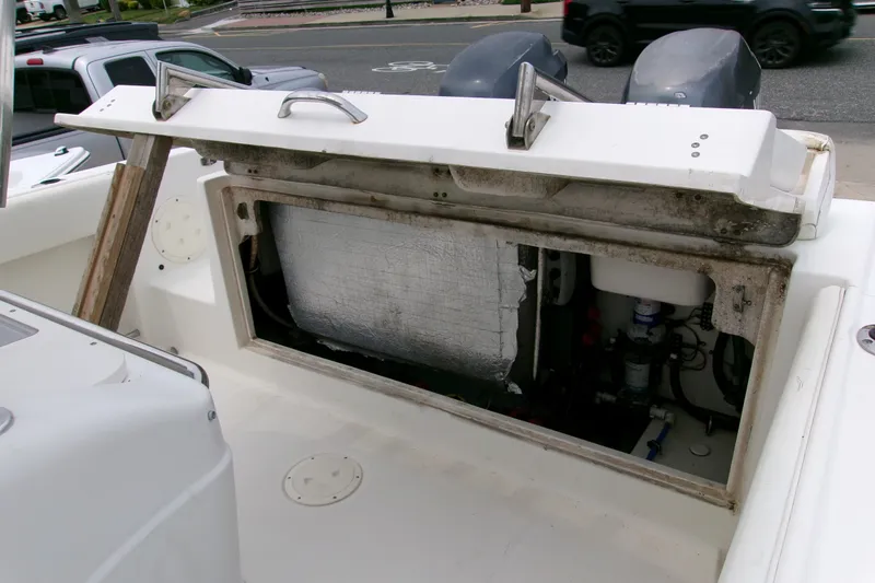 Slide: The Image of Open engine compartment of 2010 Robalo R240 Center Console boat. - 15