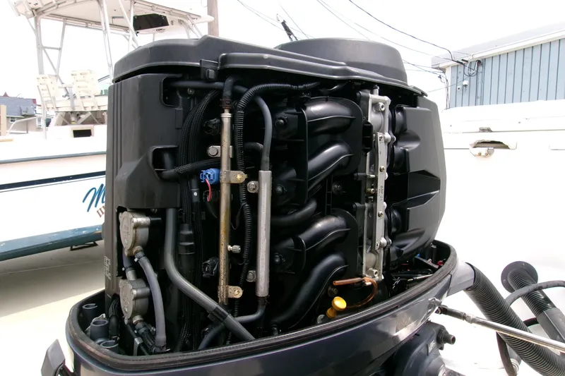 Slide: The Image of Open engine of a 2010 Robalo R240 Center Console boat, showcasing internal components. - 32