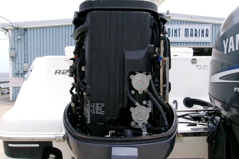 Slide: The Image of 2010 Robalo R240 Center Console boat with Yamaha outboard engine at marina. - 31