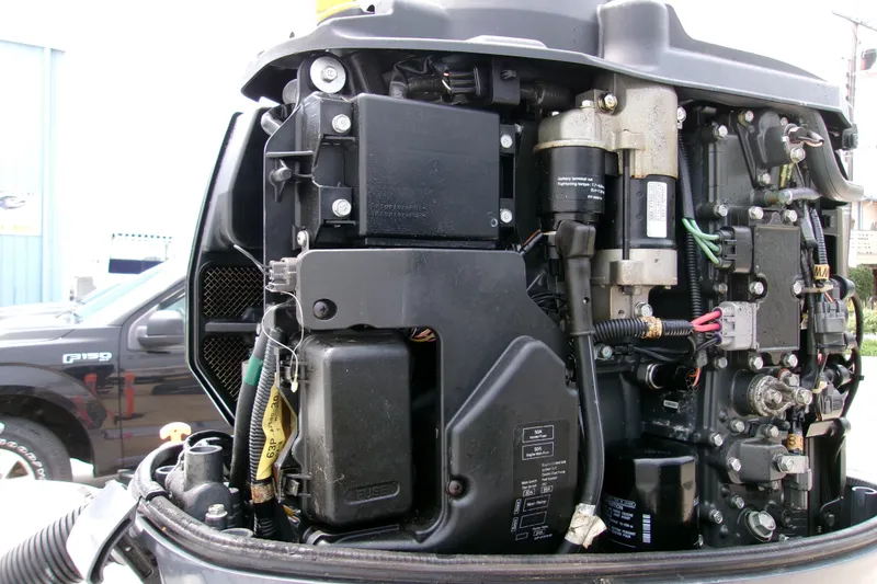 Slide: The Image of Close-up of a 2010 Robalo R240 Center Console boat engine components. - 29
