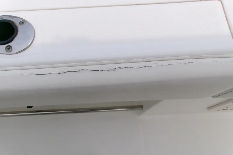 Slide: The Image of Cracked surface on 2010 Robalo R240 Center Console boat. - 48