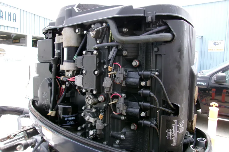 Slide: The Image of Close-up of a Yamaha outboard motor on a 2010 Robalo R240 Center Console boat. - 28