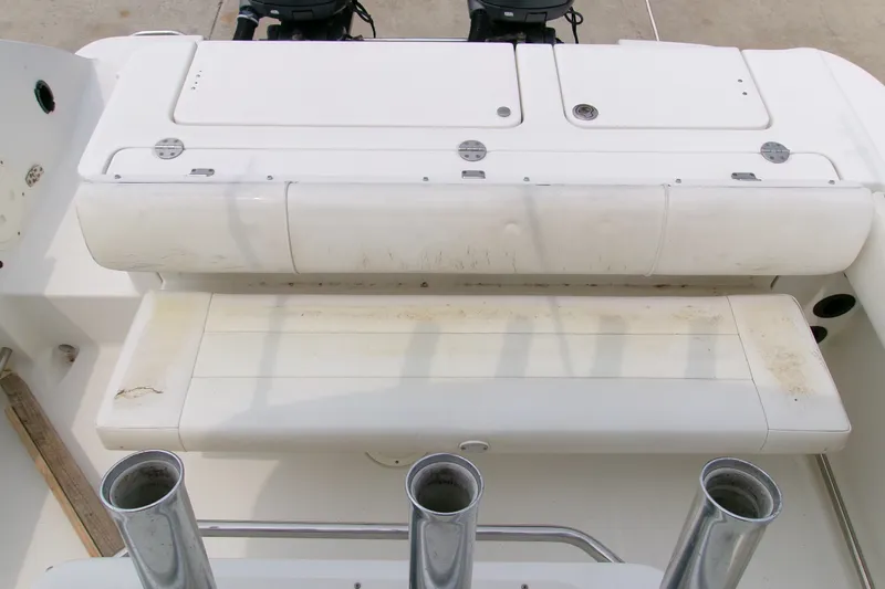 Slide: The Image of 2010 Robalo R240 Center Console boat seating and storage area. - 25