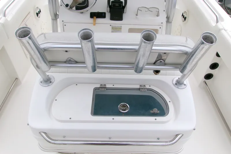 Slide: The Image of 2010 Robalo R240 Center Console boat with rod holders and livewell. - 11