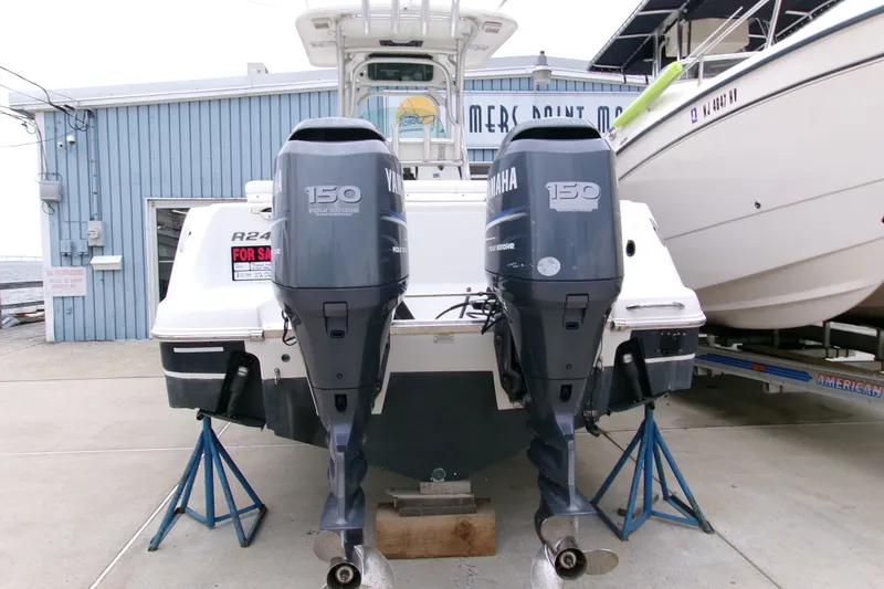 Slide: The Image of 2010 Robalo R240 Center Console boat with twin Yamaha 150 engines for sale. - 1