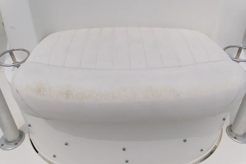Slide: The Image of White cushioned seat on 2010 Robalo R240 Center Console boat. - 24