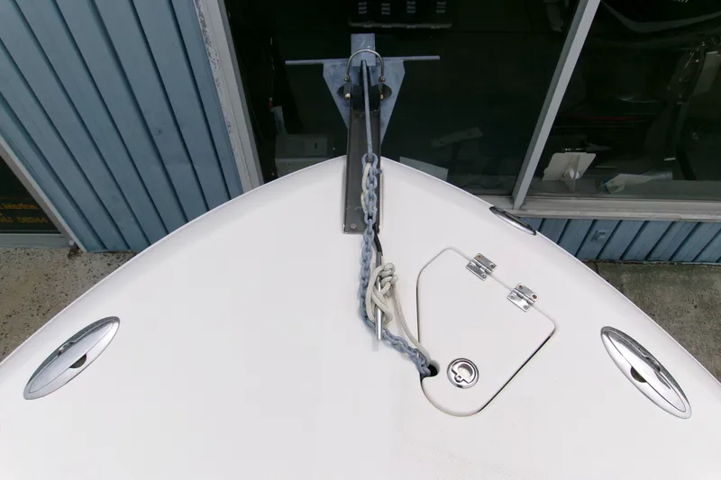 Slide: The Image of Bow view of 2010 Robalo R240 Center Console with anchor chain and hatch. - 46
