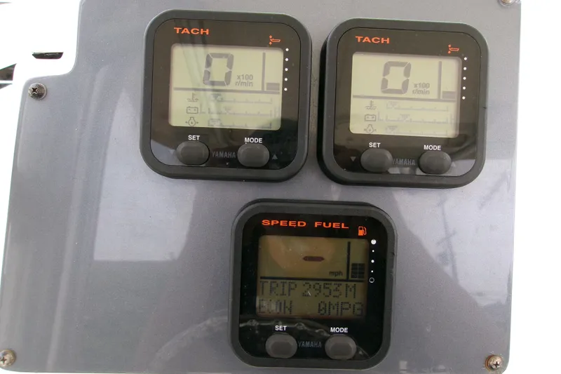 Slide: The Image of Dashboard of a 2010 Robalo R240 Center Console boat with Yamaha gauges. - 14