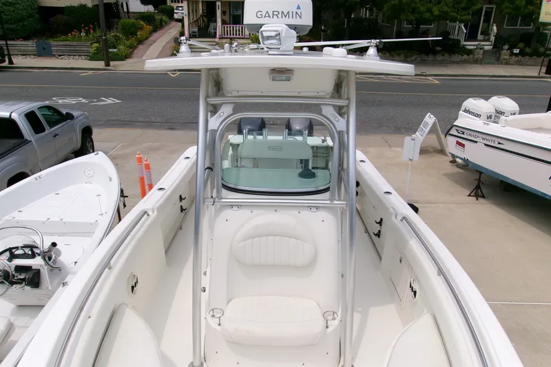 Slide: The Image of 2010 Robalo R240 Center Console boat with Garmin equipment, docked in a marina. - 23