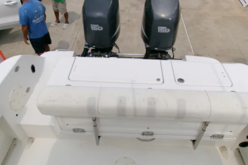 Slide: The Image of 2010 Robalo R240 Center Console boat with dual outboard engines. - 4