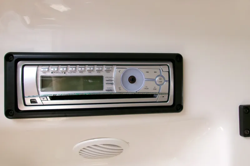 Slide: The Image of Built-in stereo system on a 2010 Robalo R240 Center Console boat. - 39