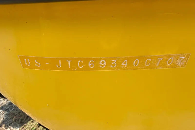 Slide: The Image of Yellow 2007 Crownline 21 SS boat with visible hull identification number. - 11