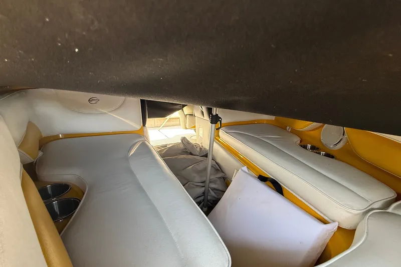 Slide: The Image of Interior of 2007 Crownline 21 SS boat with white and yellow seating. - 14