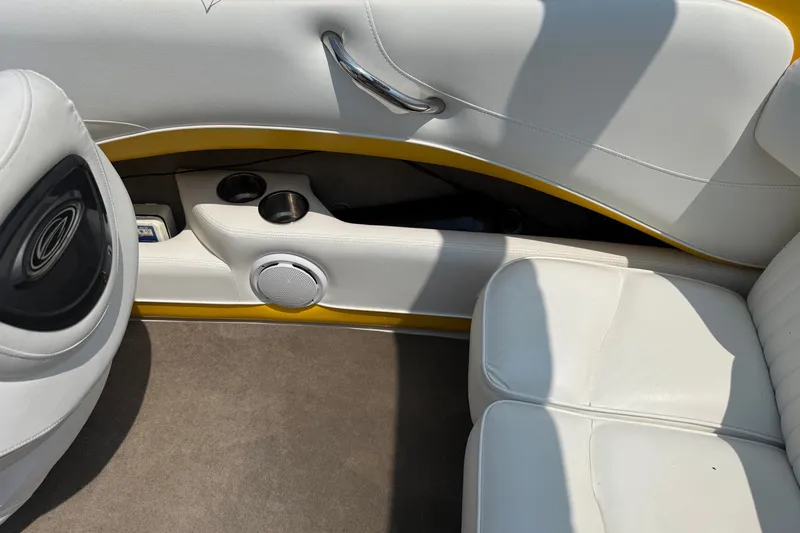 Slide: The Image of Interior of 2007 Crownline 21 SS boat with white seating and cup holders. - 23