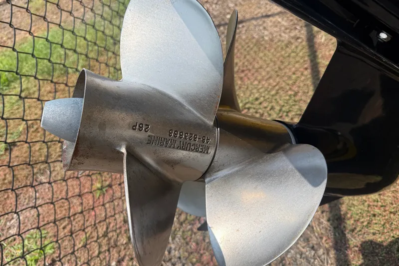 Slide: The Image of Close-up of a 2007 Crownline 21 SS boat propeller with engraved details. - 10