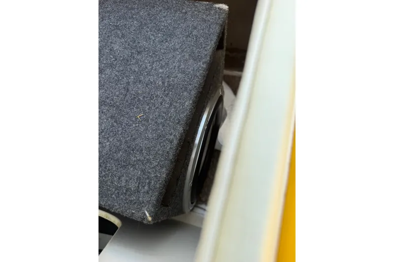 Slide: The Image of Subwoofer in a 2007 Crownline 21 SS boat, partially enclosed in a carpeted box. - 34