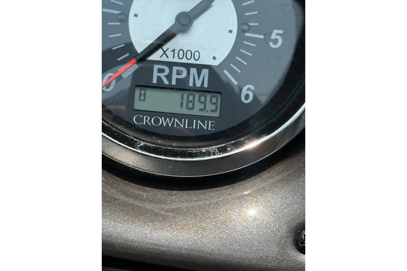 Slide: The Image of Close-up of a 2007 Crownline 21 SS RPM gauge displaying 189.9 hours. - 38
