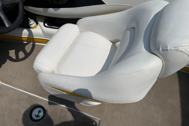 Slide: The Image of White leather seat in a 2007 Crownline 21 SS boat interior. - 24
