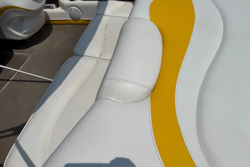 Slide: The Image of 2007 Crownline 21 SS boat interior with white and yellow upholstery. - 20