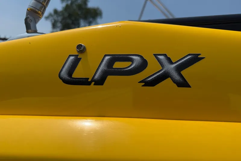 Slide: The Image of Yellow 2007 Crownline 21 SS boat with LPX logo detail. - 6