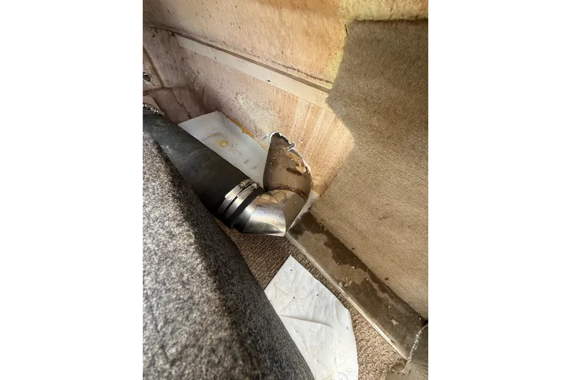 Slide: The Image of Interior view of a 2007 Crownline 21 SS boat showing a metal pipe and carpeted area. - 37