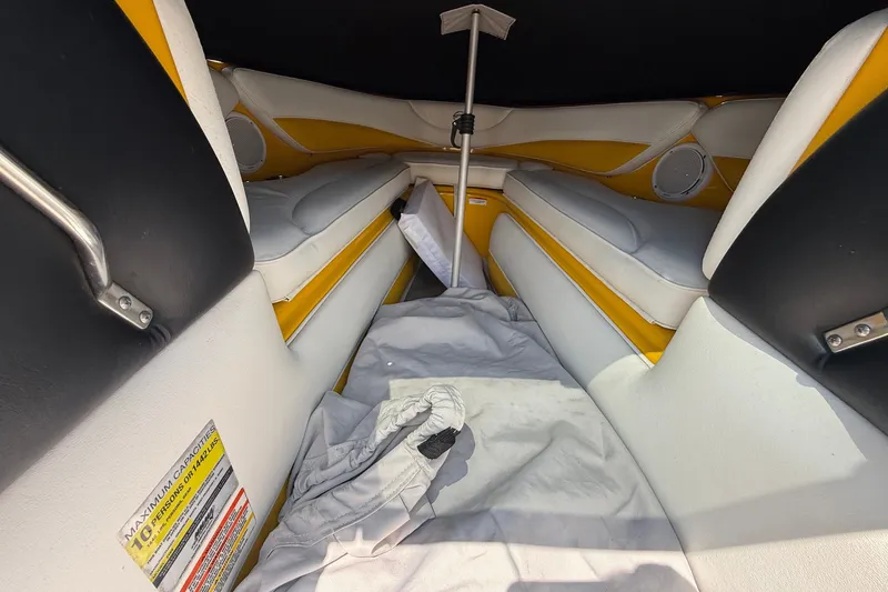 Slide: The Image of Interior of 2007 Crownline 21 SS boat with yellow and white seating. - 30