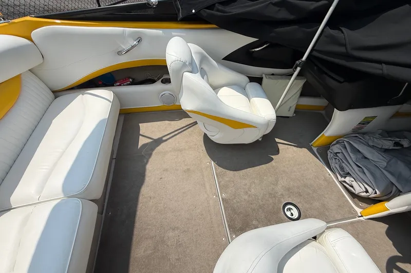 Slide: The Image of Interior of a 2007 Crownline 21 SS boat with white and yellow seating. - 26