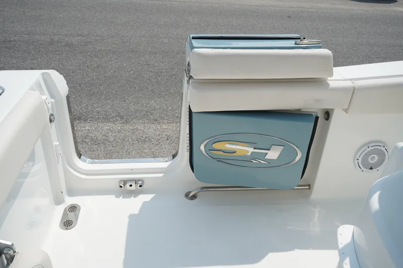 Slide: The Image of 2022 Sea Hunt Gamefish 25 boat interior with seating and storage compartment. - 14