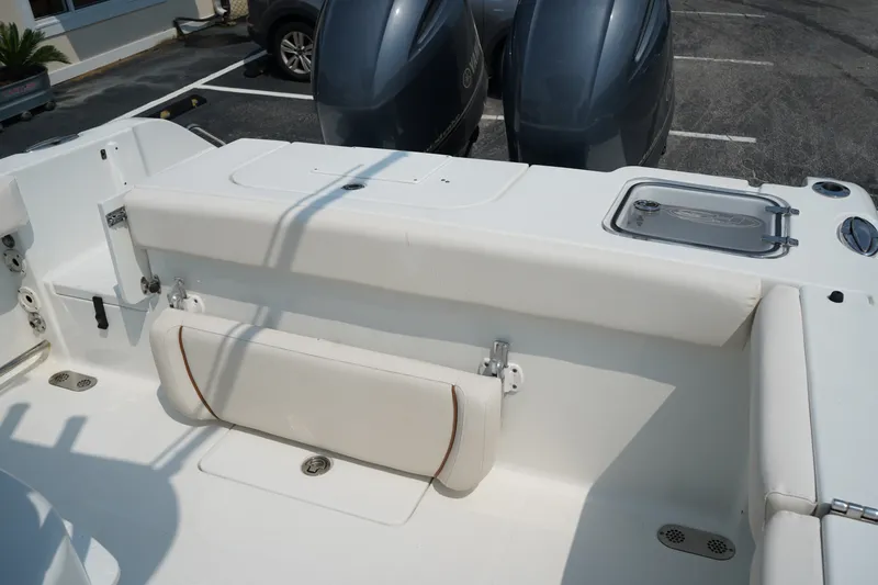 Slide: The Image of 2022 Sea Hunt Gamefish 25 boat interior with seating and dual engines. - 12